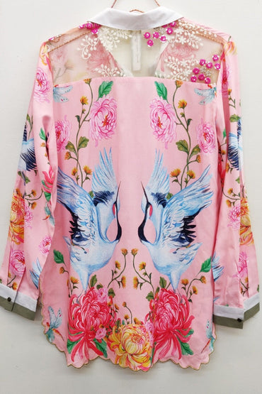 Trestles Clothing Company pink viscose blouse featuring crane and floral print with embroidered tulle back detail.