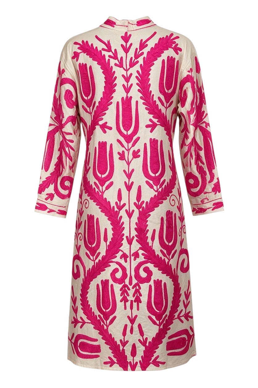 Trestles Clothing Company cotton duster featuring vibrant hot pink floral embroidery on a cream canvas background.