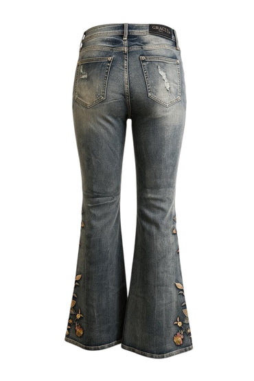 Trestles Clothing Company washed blue denim jeans with floral embroidery and distressed back pockets