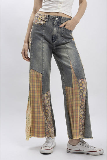 Trestles Clothing Company Cut & Sew jeans featuring upcycled denim with floral and plaid patchwork panels and raw hems.