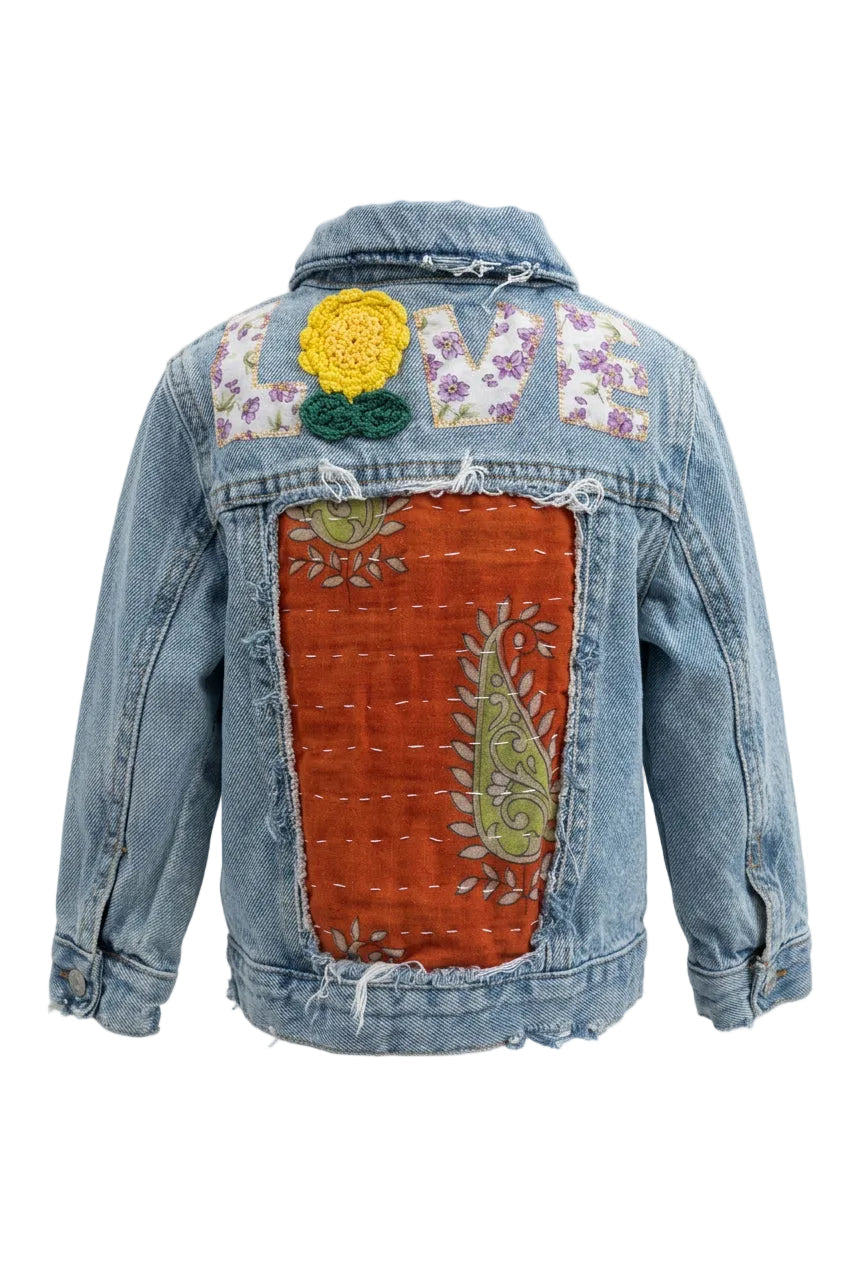 Trestles Clothing Company upcycled denim jacket for toddlers with back patchwork, floral appliqué, and LOVE lettering.