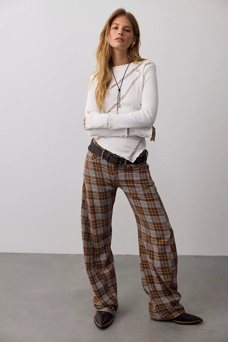 Trestles Clothing Company white waffle knit long sleeve top with lace panels, lettuce edge trim, and pointed hem.