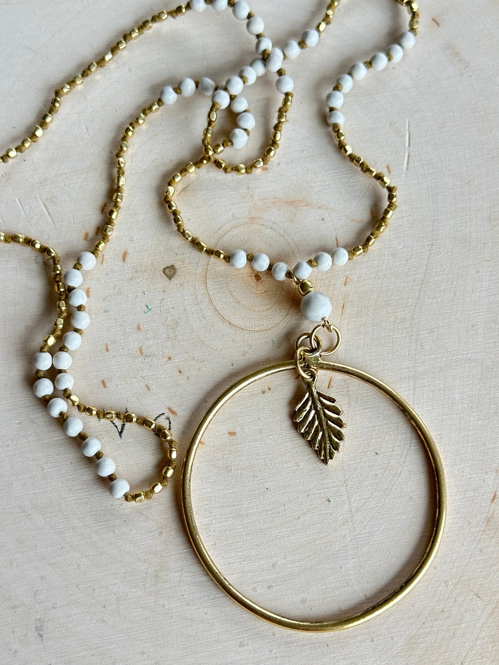 White Bead On Gold Necklace