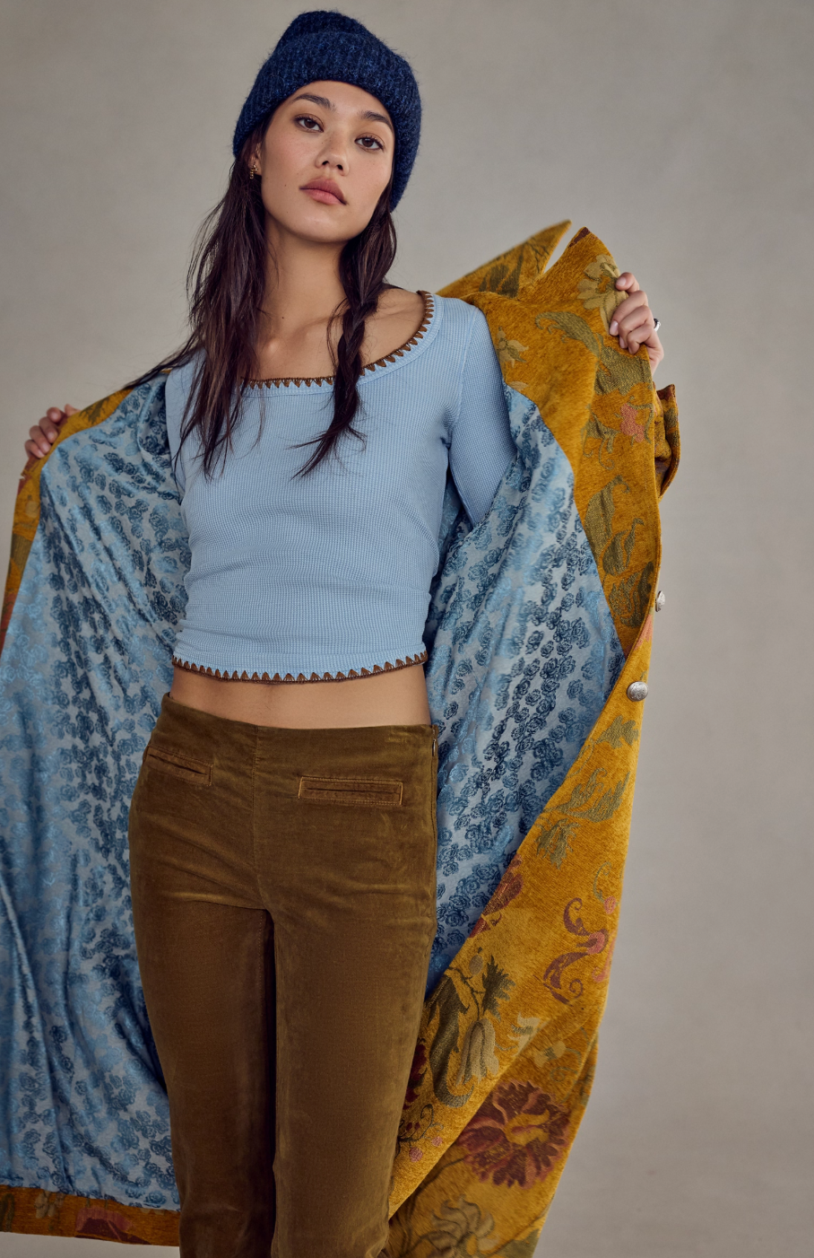Trestles Clothing Company Aspen Thermal top in light blue waffle knit with contrast stitching worn under a coat