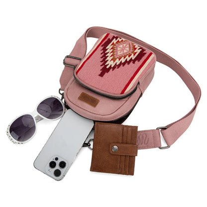 Trestles Clothing Company Aztec sling bag in pink canvas and PU leather with a crossbody strap and organized interior