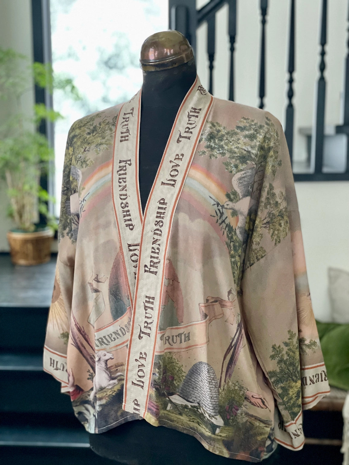 Trestles Clothing Company cropped kimono in bamboo fabric with vintage rainbow and landscape print on a mannequin