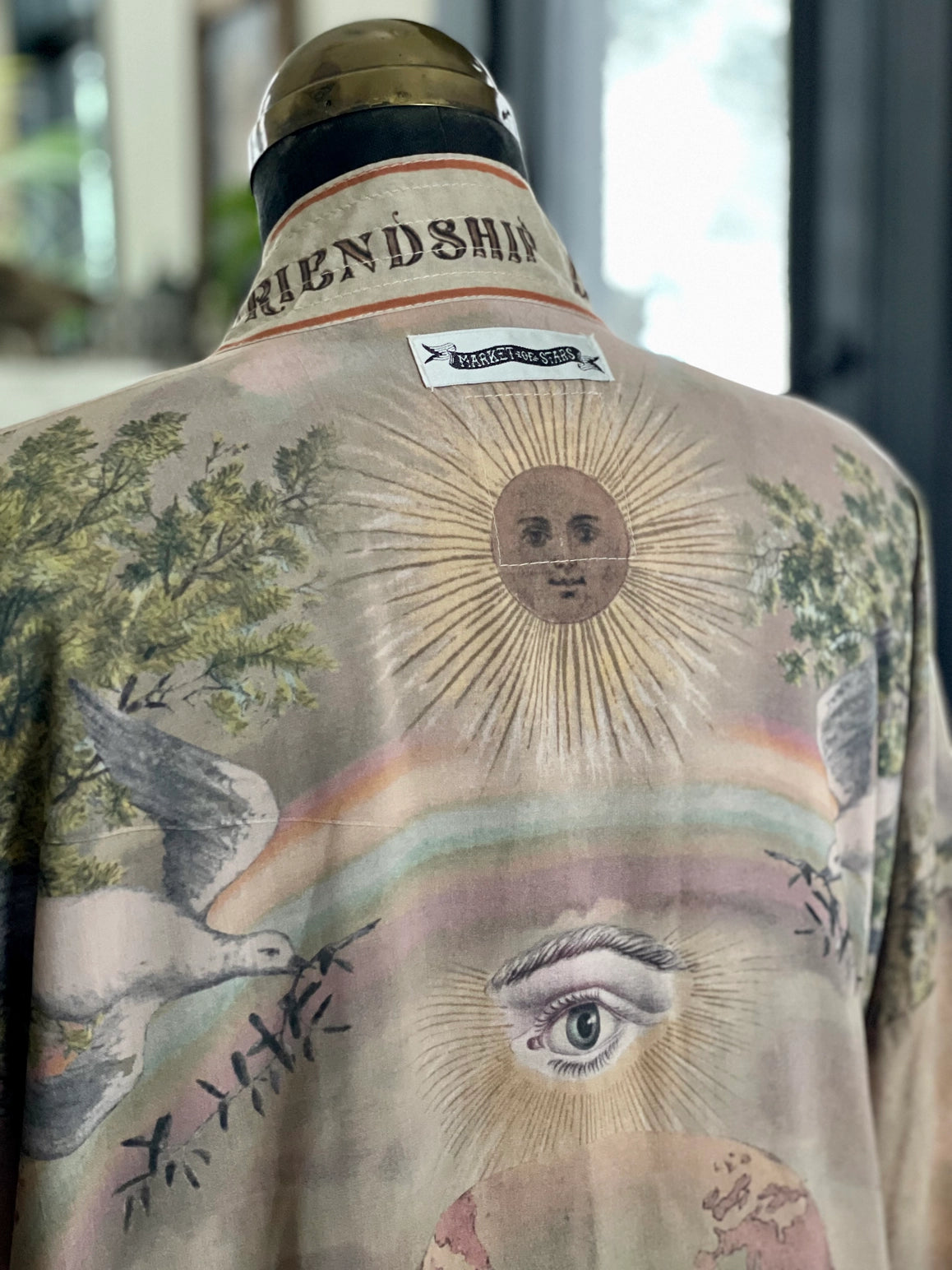 Trestles Clothing Company cropped kimono in bamboo fabric with vintage sun, eye, and rainbow back print
