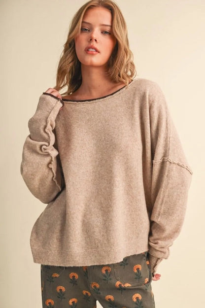 Trestles Clothing Company relaxed beige boatneck sweater with contrast rolled edges and drop shoulder sleeves on model