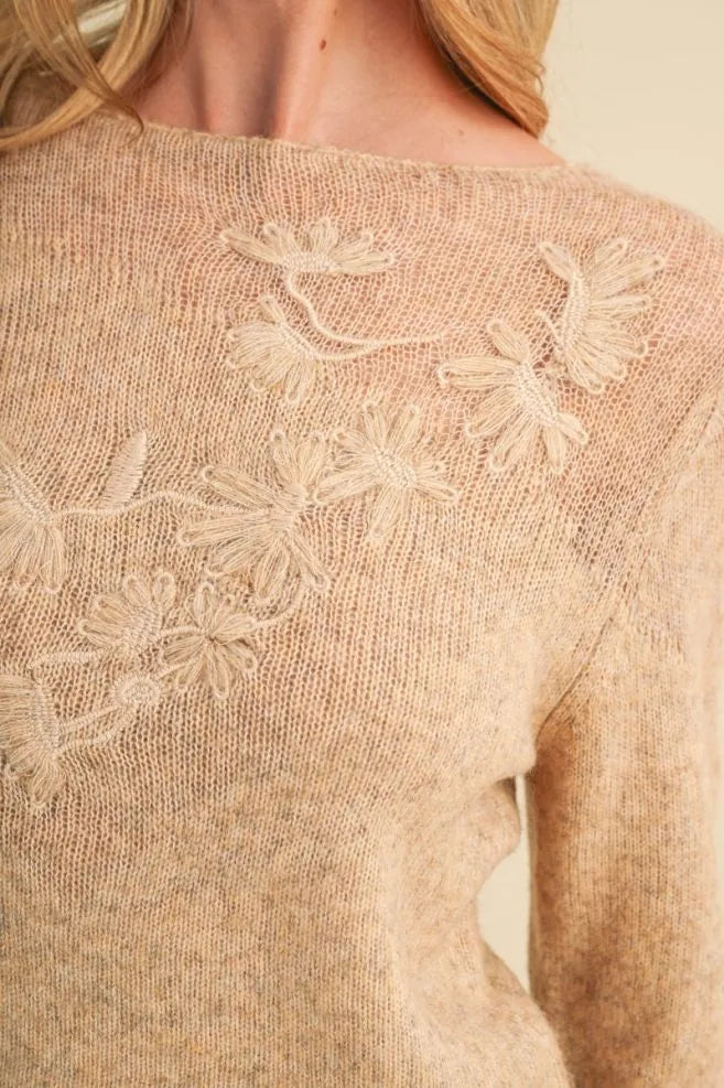 Trestles Clothing Company beige sheer knit sweater with delicate tonal floral embroidery and a feminine boat neckline