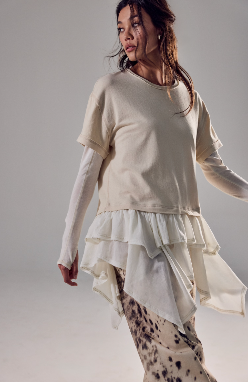 Trestles Clothing Company Tattered Love Tee featuring a beige layered boho knit top with a flowy double-layer peplum.