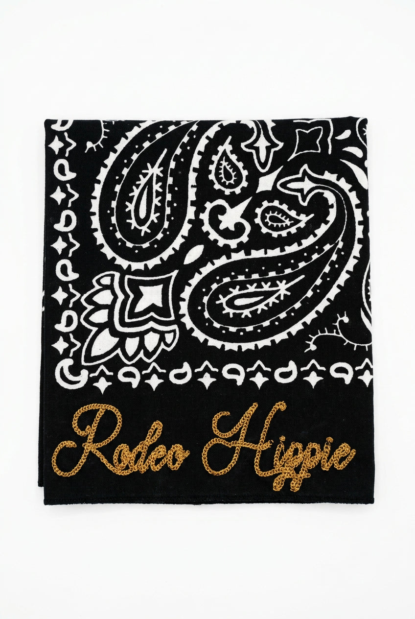 Trestles Clothing Company black stonewashed bandana with white paisley print and gold Rodeo Hippie chainstitching.