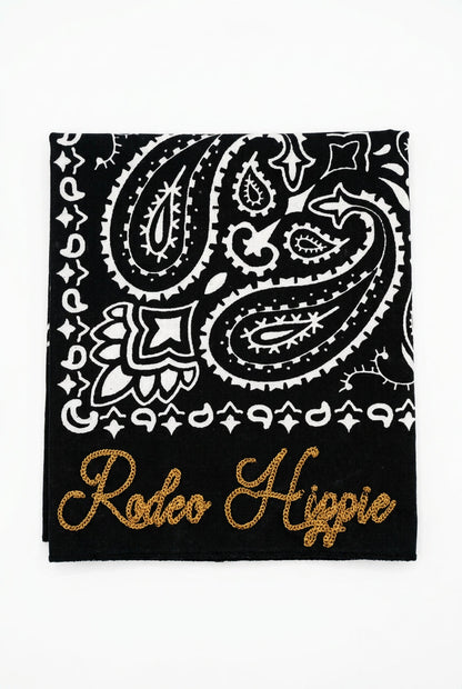 Trestles Clothing Company black stonewashed bandana with white paisley print and gold Rodeo Hippie chainstitching.