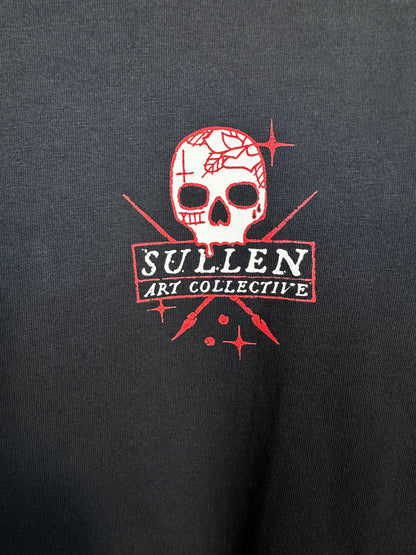 Trestles Clothing Company black cotton oversized tee featuring a red and white tattoo-inspired skull graphic