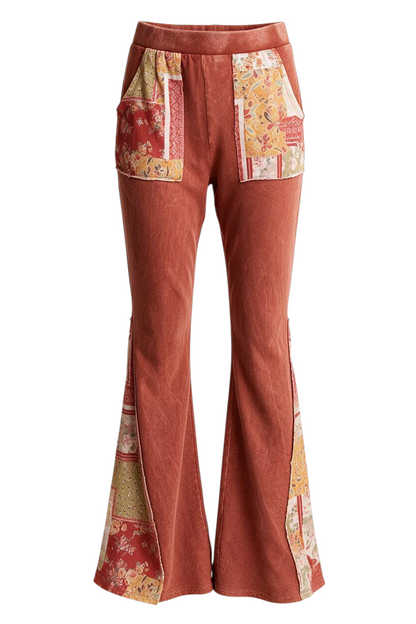 Trestles Clothing Company mineral washed terracotta bell bottom pants with boho floral patch pockets and side panels.