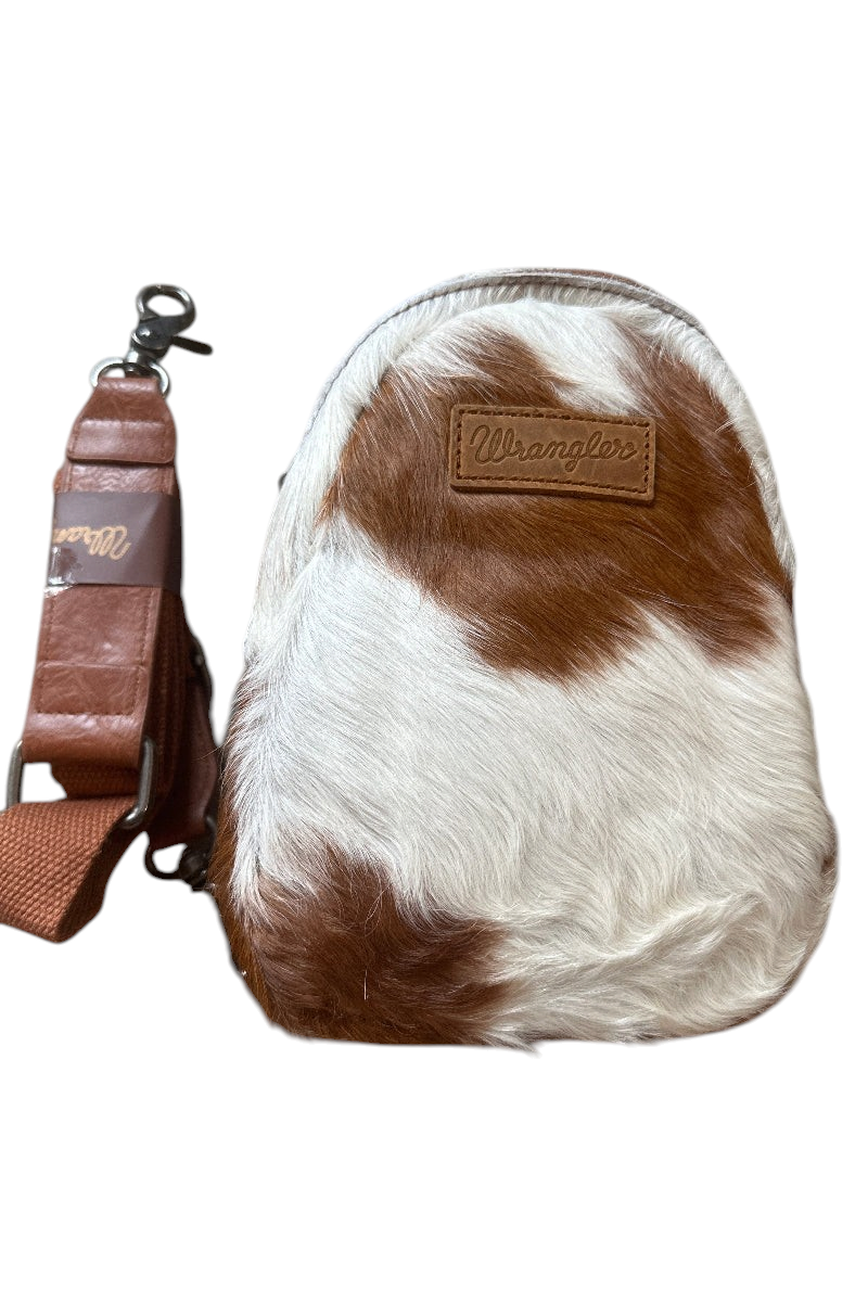 Trestles Clothing Company Western sling bag in brown and white hair-on cowhide with a detachable leather strap
