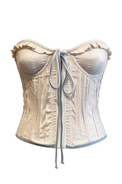 Trestles Clothing Company vintage style corset in cream with blue velvet trim, ruffle detail, and adjustable ties.