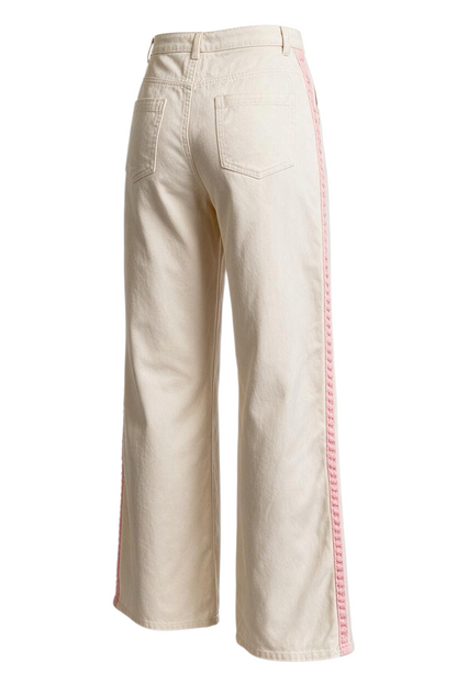 Trestles Clothing Company wide leg cotton pants in cream with pink side stripe detail, back view.