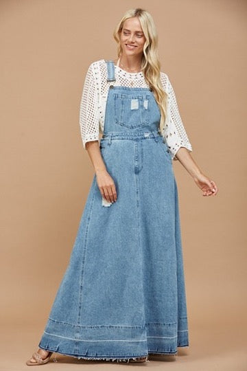 Trestles Clothing Company light wash denim maxi overall dress with distressed details and a wide skirt