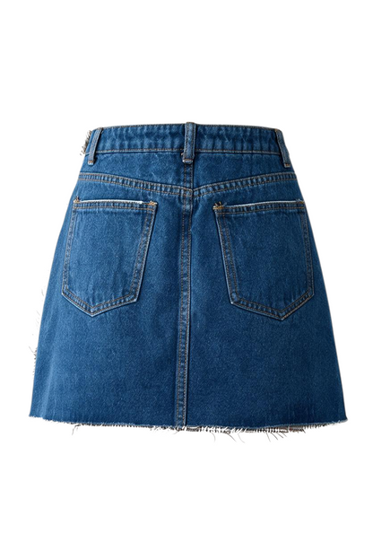 Trestles Clothing Company micro mini skirt featuring a blue denim back with pockets and frayed hem detail.