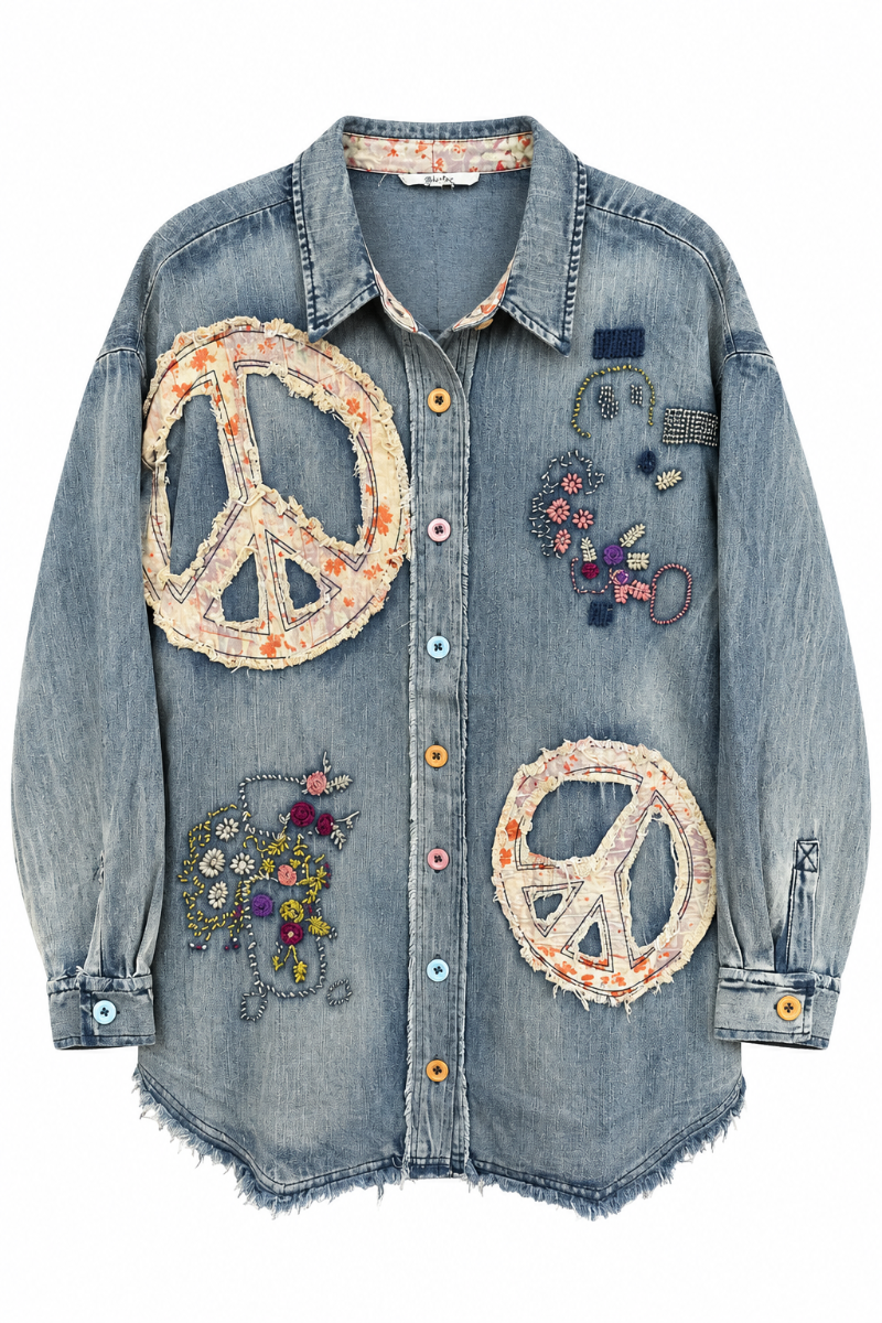 Trestles Clothing Company oversized denim shirt with peace sign appliqués, floral embroidery, and mismatched buttons.