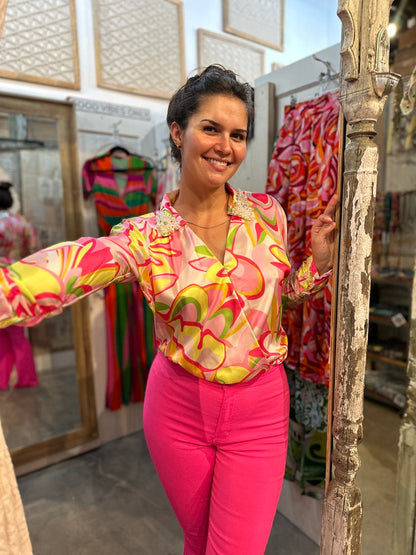 Trestles Clothing Company Disco Bodysuit with long sleeves, vibrant retro print, and pearl-embellished collar