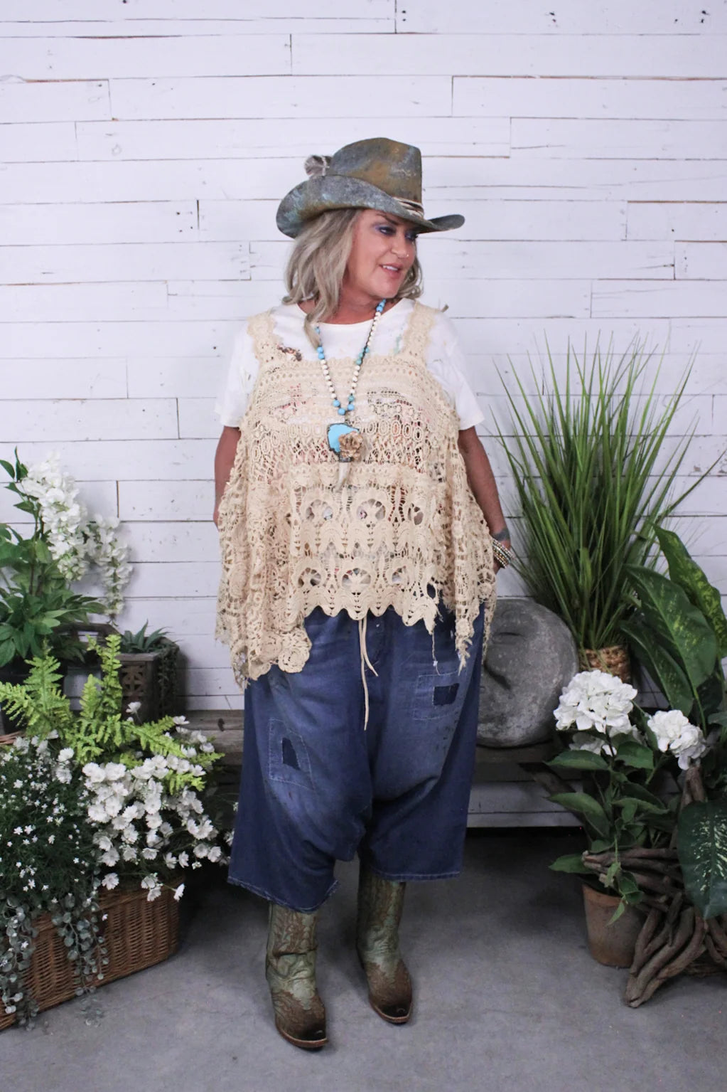 Trestles Clothing Company Earthsong harem pants in distressed blue cotton worn with a crochet top and cowboy hat