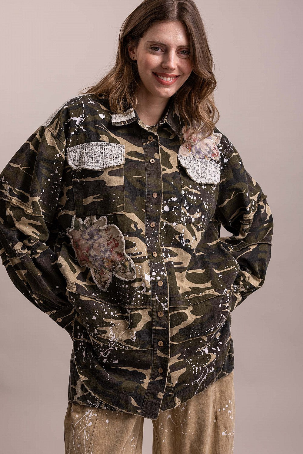 Trestles Clothing Company floral patched camo shacket with paint splatters and button-front cotton design.