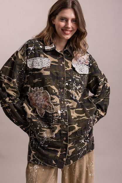 Trestles Clothing Company floral patched camo shacket with paint splatters and button-front cotton design.