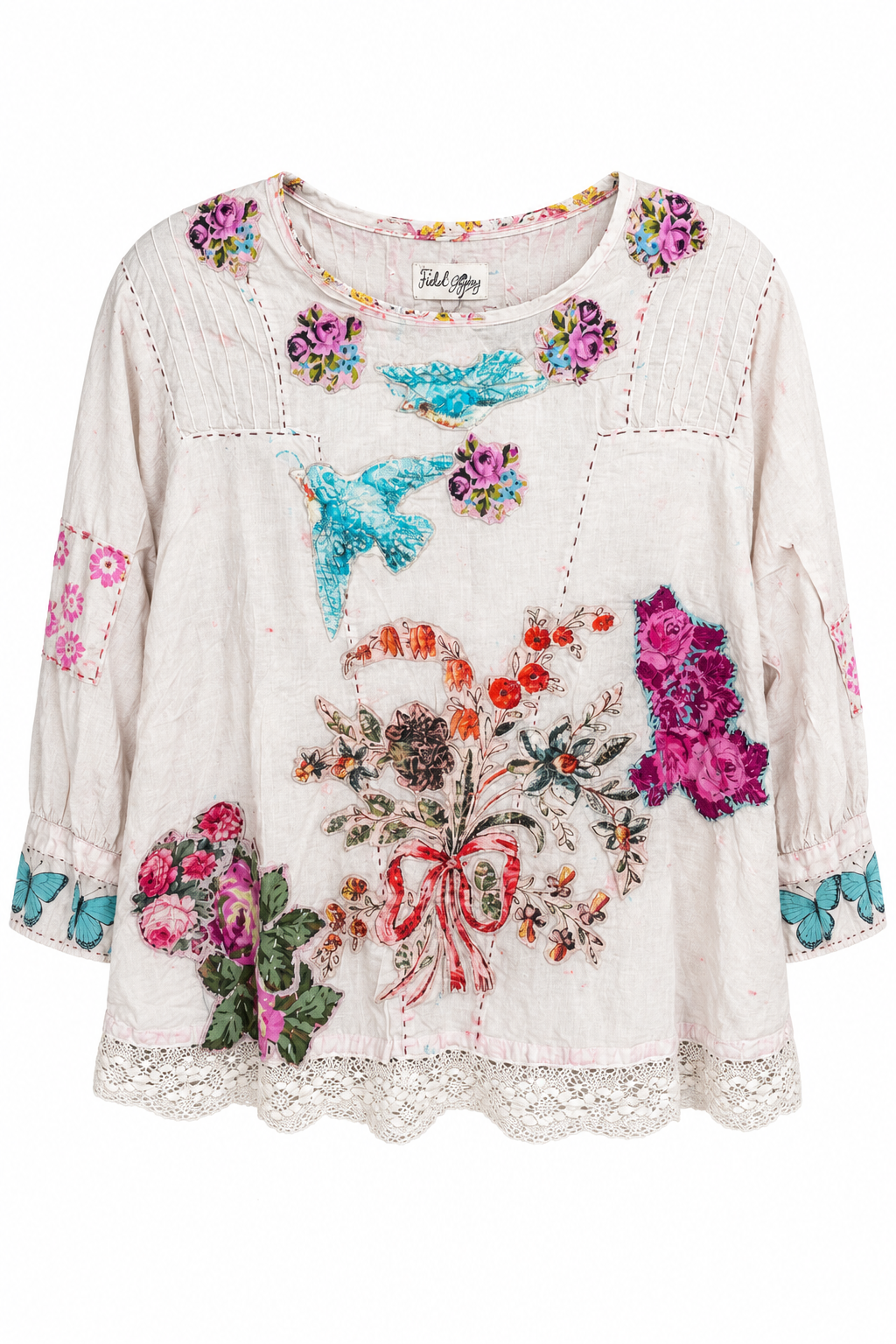 Trestles Clothing Company vintage-inspired cotton blouse with hand-stitched floral patches and delicate lace hem.