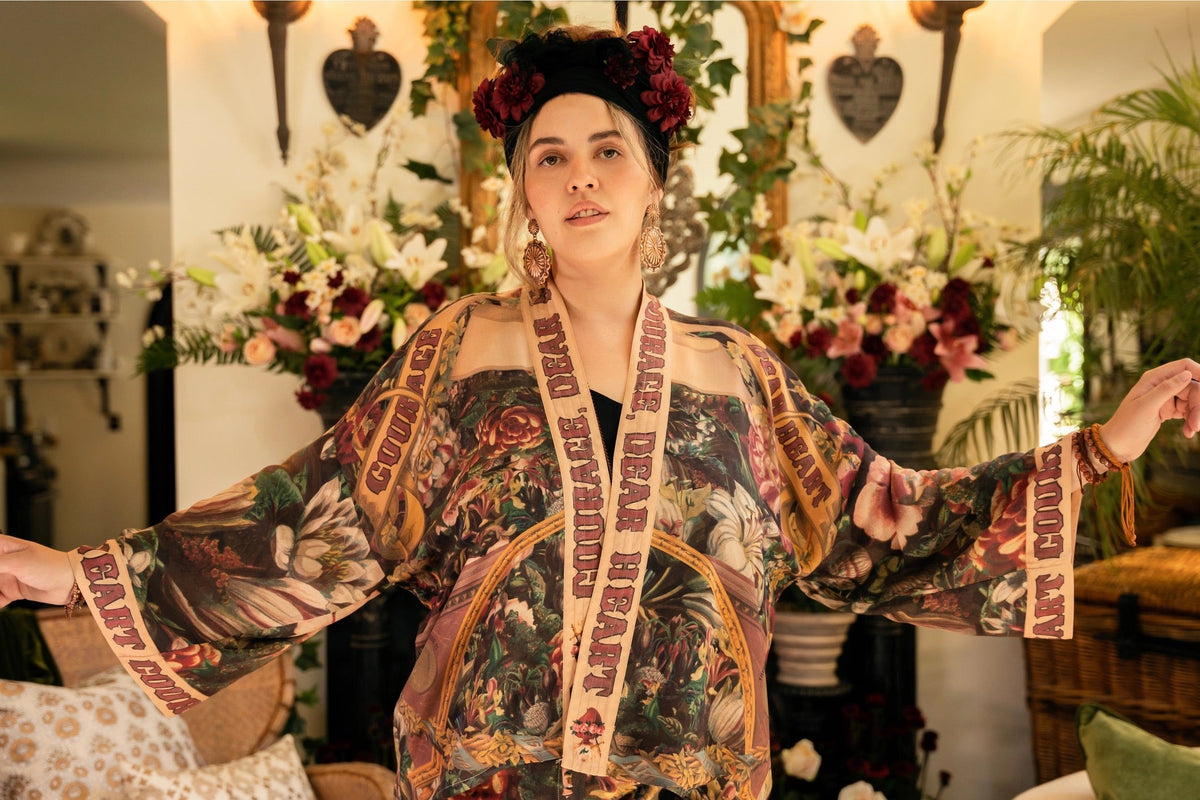 Trestles Clothing Company cropped kimono featuring archival 1800s floral artwork and Courage Dear Heart trim text