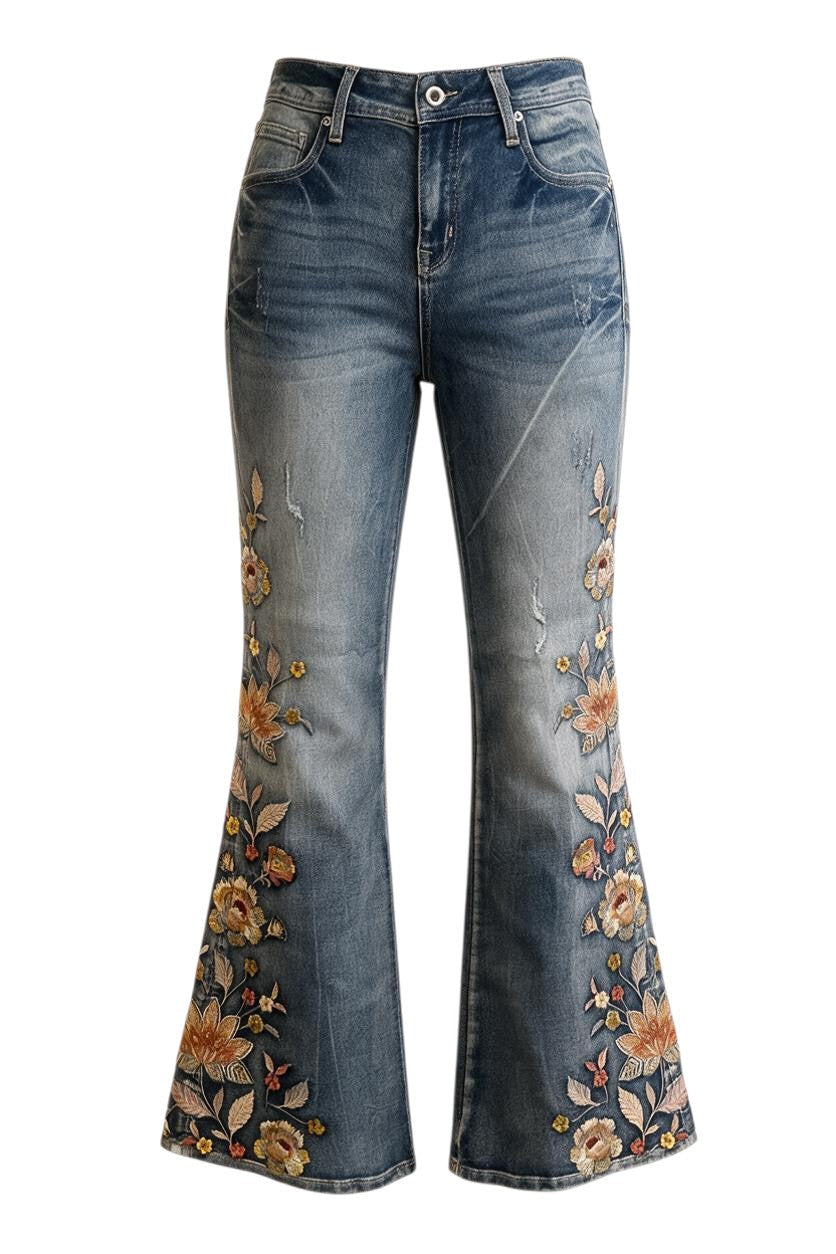 Trestles Clothing Company washed blue denim jeans featuring cascading floral embroidery and a vintage flared fit.