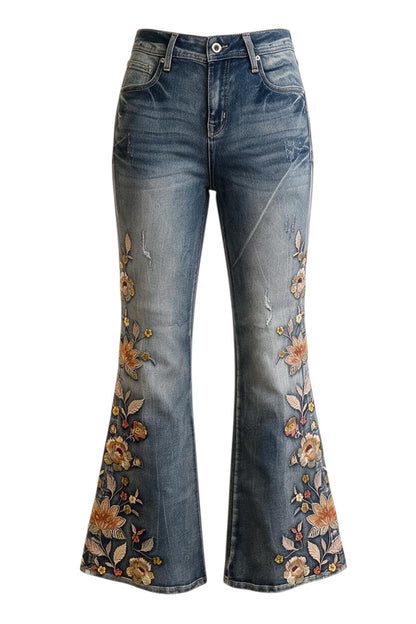 Trestles Clothing Company washed blue denim jeans featuring cascading floral embroidery and a vintage flared fit.