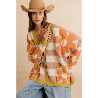 Trestles Clothing Company oversized knit cardigan with retro floral pattern, horizontal stripes, and front pockets