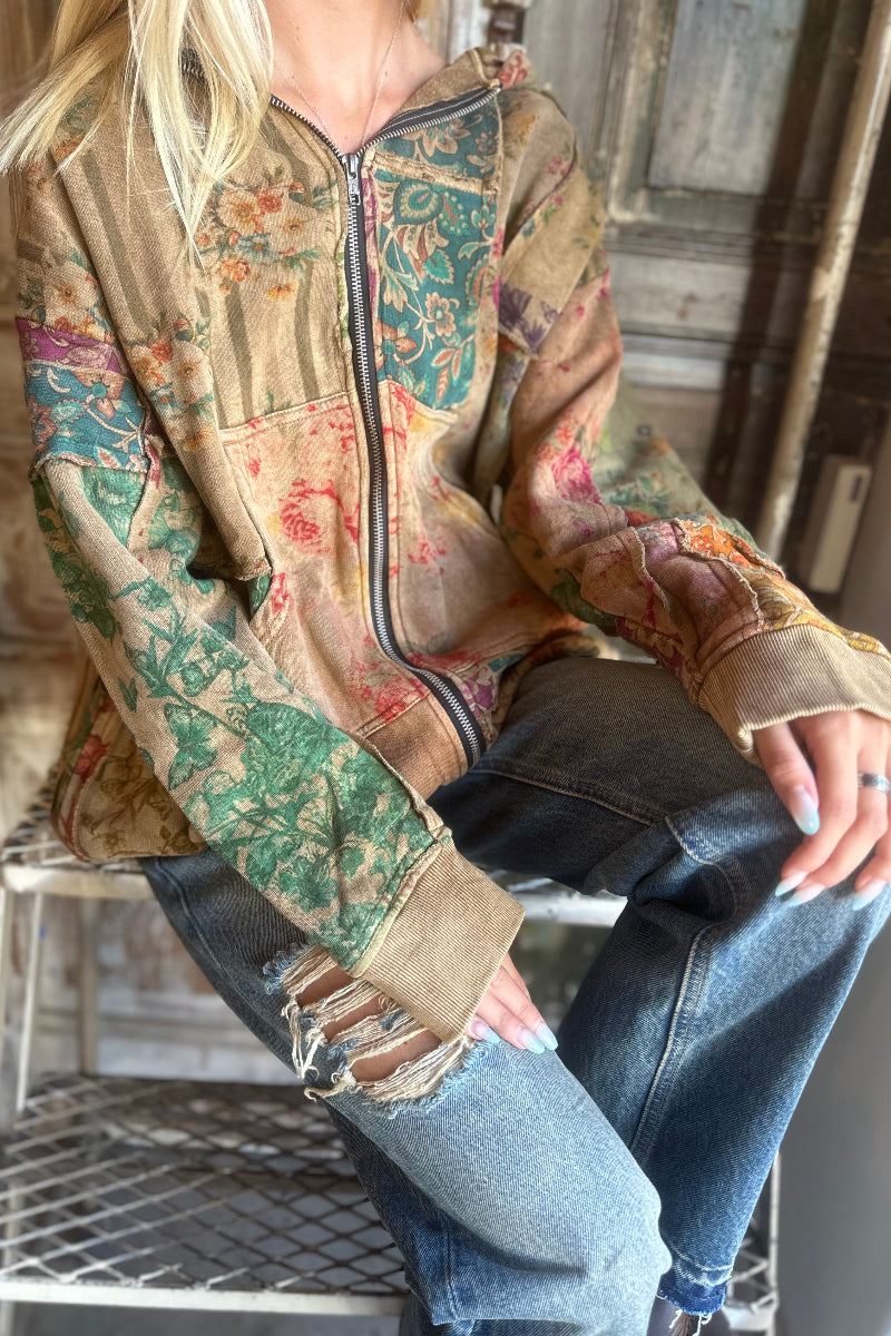 Trestles Clothing Company floral patchwork zip-up hoodie in warm autumn colors with kangaroo pockets and ribbed cuffs