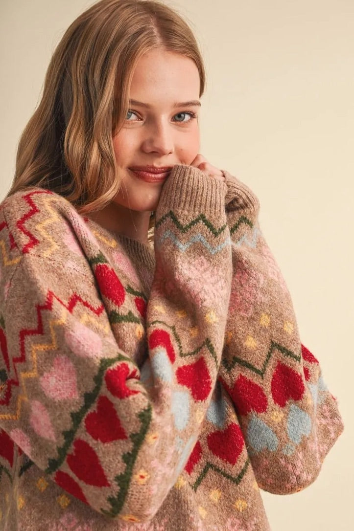 Trestles Clothing Company Gingerbread Hearts Sweater with a cozy knit, geometric heart pattern, and round neckline.
