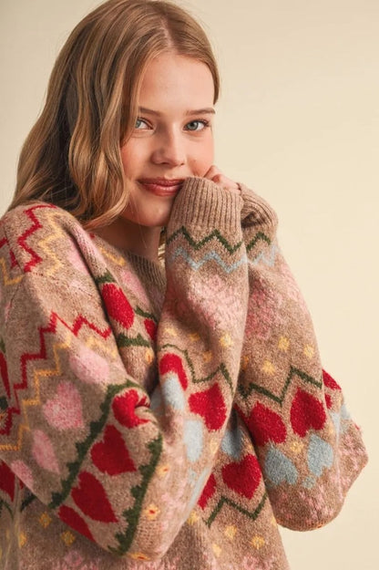 Trestles Clothing Company Gingerbread Hearts Sweater with a cozy knit, geometric heart pattern, and round neckline.