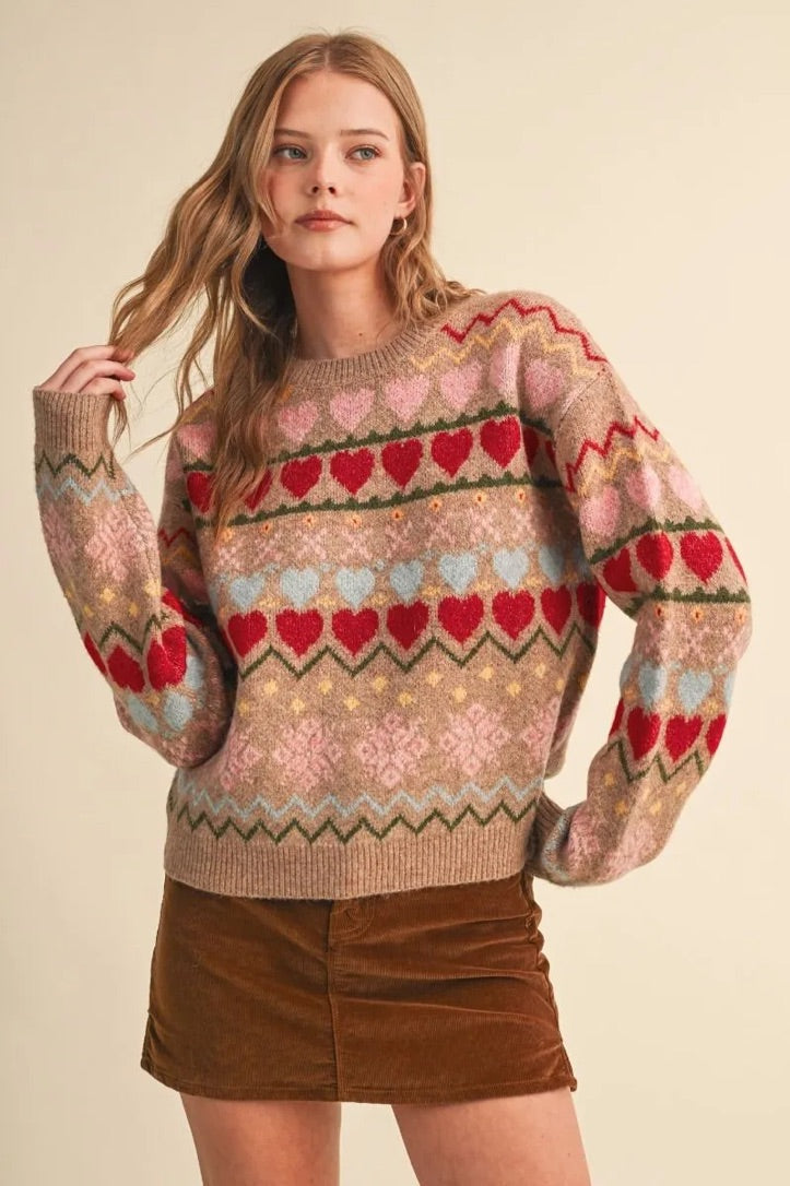Trestles Clothing Company gingerbread hearts sweater with a geometric knit pattern, round neck, and relaxed fit.