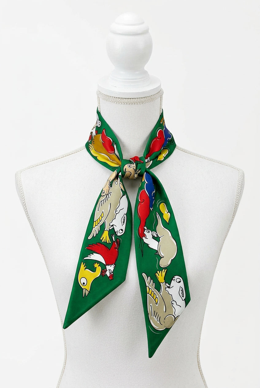 Trestles Clothing Company green silky twilly scarf featuring a colorful animal print pattern for hair or bag styling