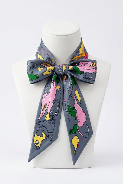 Trestles Clothing Company skinny twilly scarf in grey with a colorful animal print pattern and silky-feel finish
