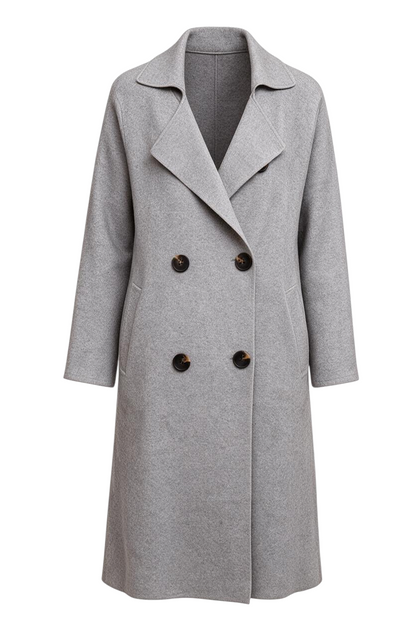 Model wearing a Trestles Clothing Company Beckham grey cashmere blend midi sweater coat with double-breasted buttons.