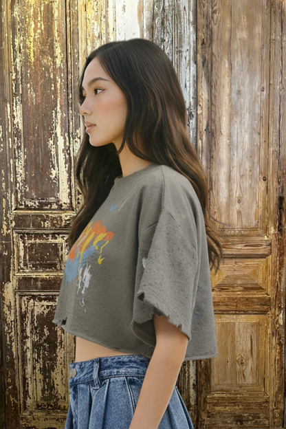 Trestles Clothing Company Rebel Echo Tee in grey with distressed raw hem and colourful graphic print on a model