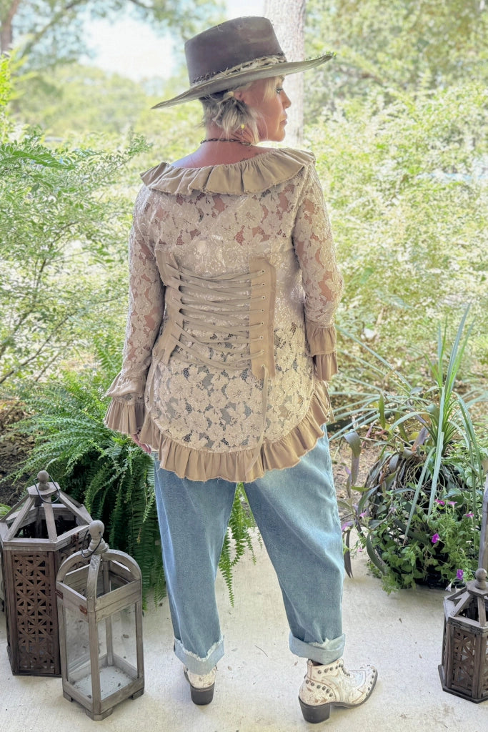 Trestles Clothing Company lace jacket with back corset ties, ruffled hem, and sleeves worn by a woman in a hat