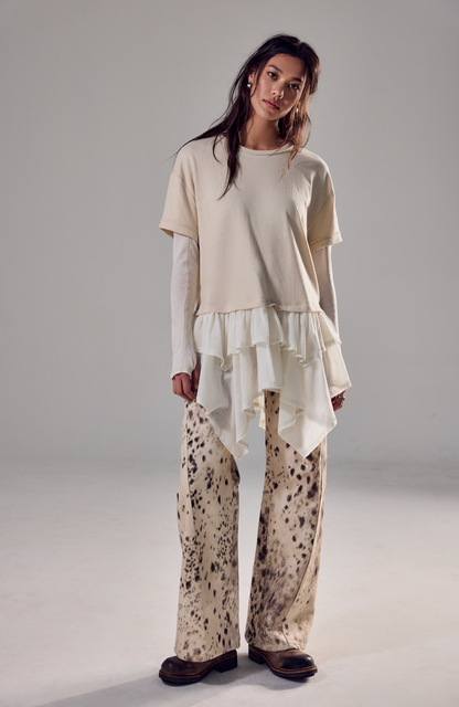 Trestles Clothing Company Tattered Love Tee featuring a beige knit top with double-layer peplum and short sleeves.