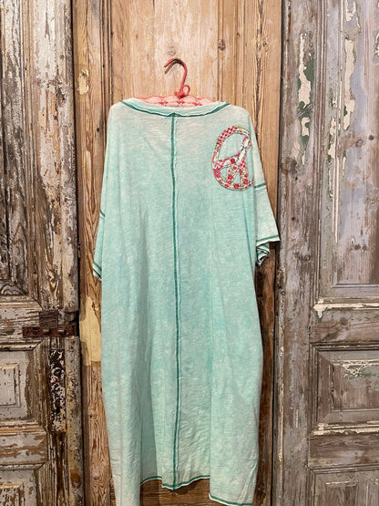 Trestles Clothing Company oversized mineral washed mint green knit tee with a red floral peace sign applique