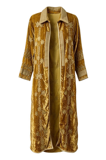 Trestles Clothing Company mustard yellow velvet duster coat with intricate floral embroidery and a structured collar.