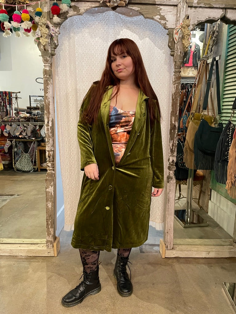 Trestles Clothing Company Old World Bodysuit with shiny print worn under a long olive green velvet duster coat