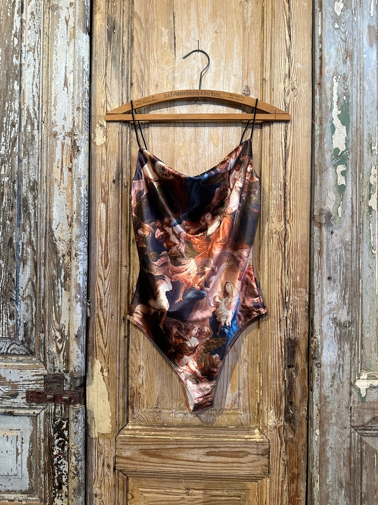 Trestles Clothing Company Old World Bodysuit with thin straps and a shiny, multi-colored classical art print.