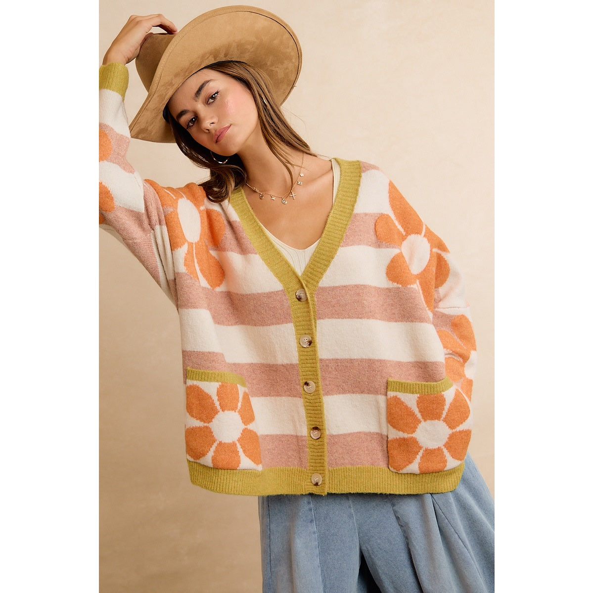 Trestles Clothing Company oversized knit cardigan with retro floral pattern, horizontal stripes, and front pockets.