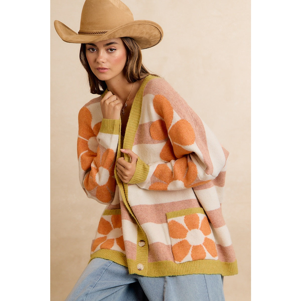 Trestles Clothing Company oversized knit cardigan with retro floral print, striped pattern, and front pockets.