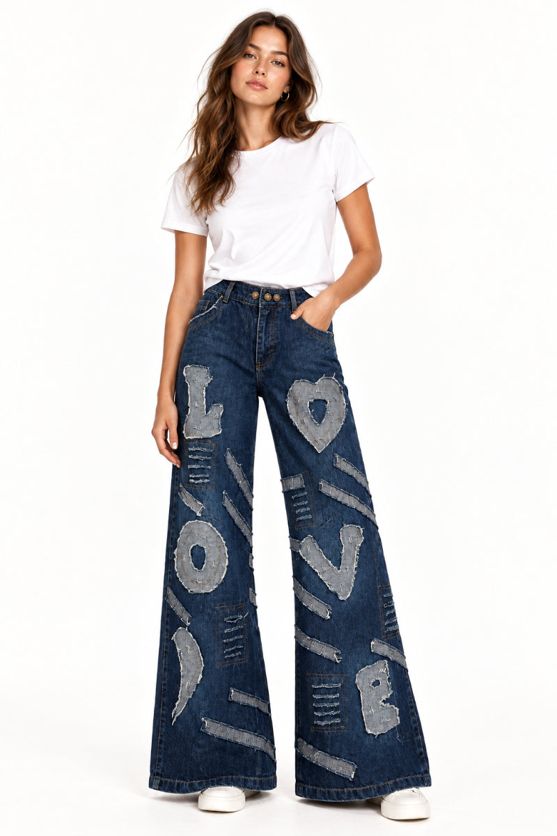 Trestles Clothing Company dark denim wide leg jeans with heart and LOVE fabric patches and distressed details
